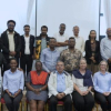 The participants, a diverse mix of men and women, are posed in two rows—one seated and one standing during the launch of Cochrane Ethiopia